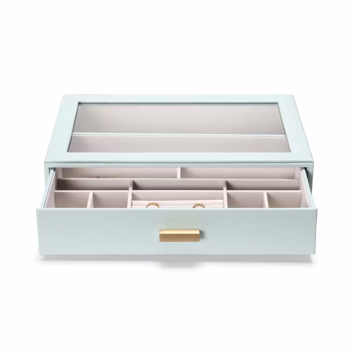 SortWithStyle aqua jewelry organizer displayed on modern vanity desk with organized necklaces, earrings, and accessories